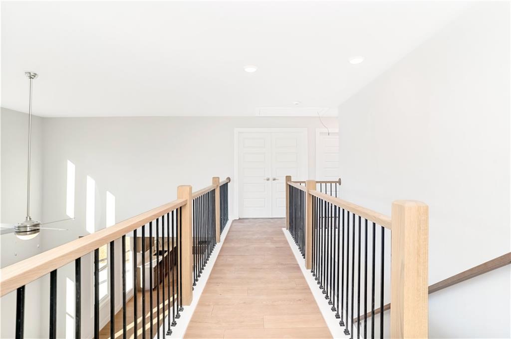 2596 Parkside Way Gainesville, GA 30507 - Photo 24 of 33 a view of a hallway with wooden floor
