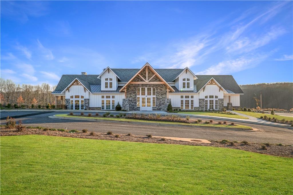 2596 Parkside Way Gainesville, GA 30507 - Photo 27 of 27 a view of house with a big yard and large trees