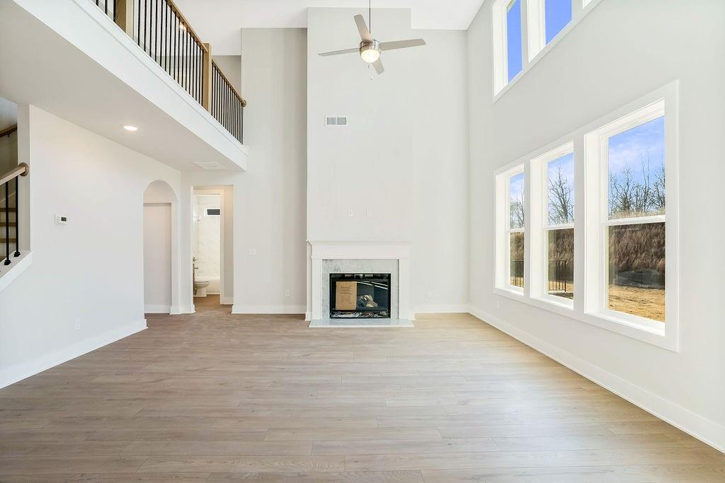 2596 Parkside Way Gainesville, GA 30507 - Photo 9 of 33 a view of an empty room with a fireplace and a window