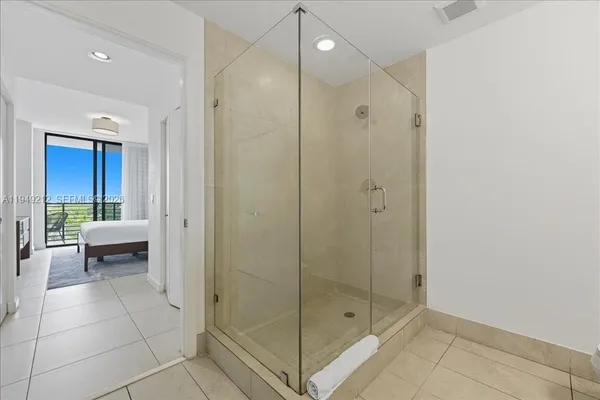 a bathroom with a shower and a sink