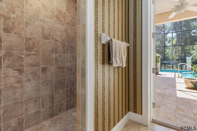 a bathroom with a shower and a sink