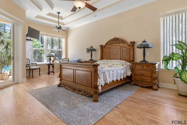 a bed room with a bed and a chair