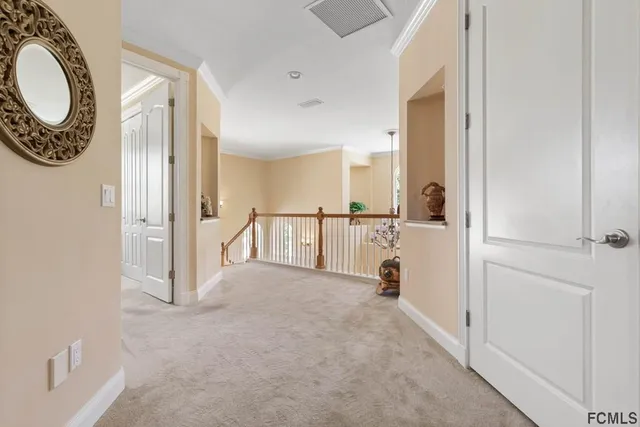 a living room with furniture kitchen view and a chandelier