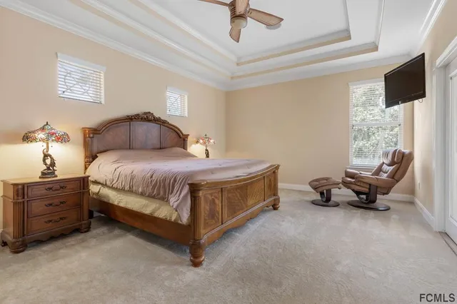 a spacious bedroom with a bed and a window