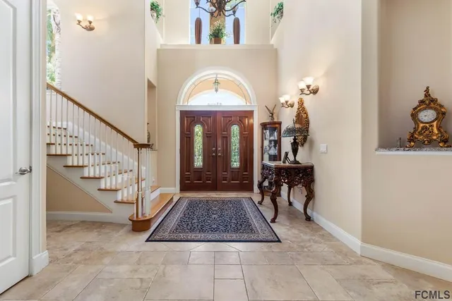 a view of living room with a table and chairs
