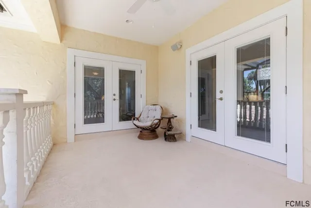 a spacious bedroom with a bed and a cabinets