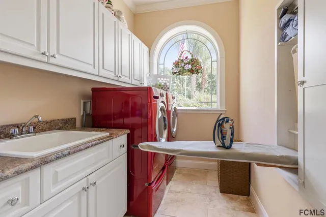 an aerial view of a house with a yard basket ball court and outdoor seating