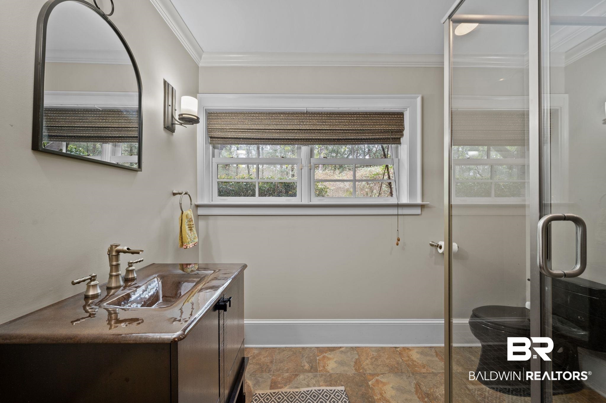 7850 Yorkhaven Road Mobile, AL 36695 - Photo 37 of 57 Full bath featuring stone finish floor, a shower stall, crown molding, baseboards, and vanity