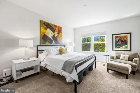 a bedroom with a bed and a couch