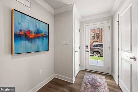 a view of a hallway with paintings on the wall