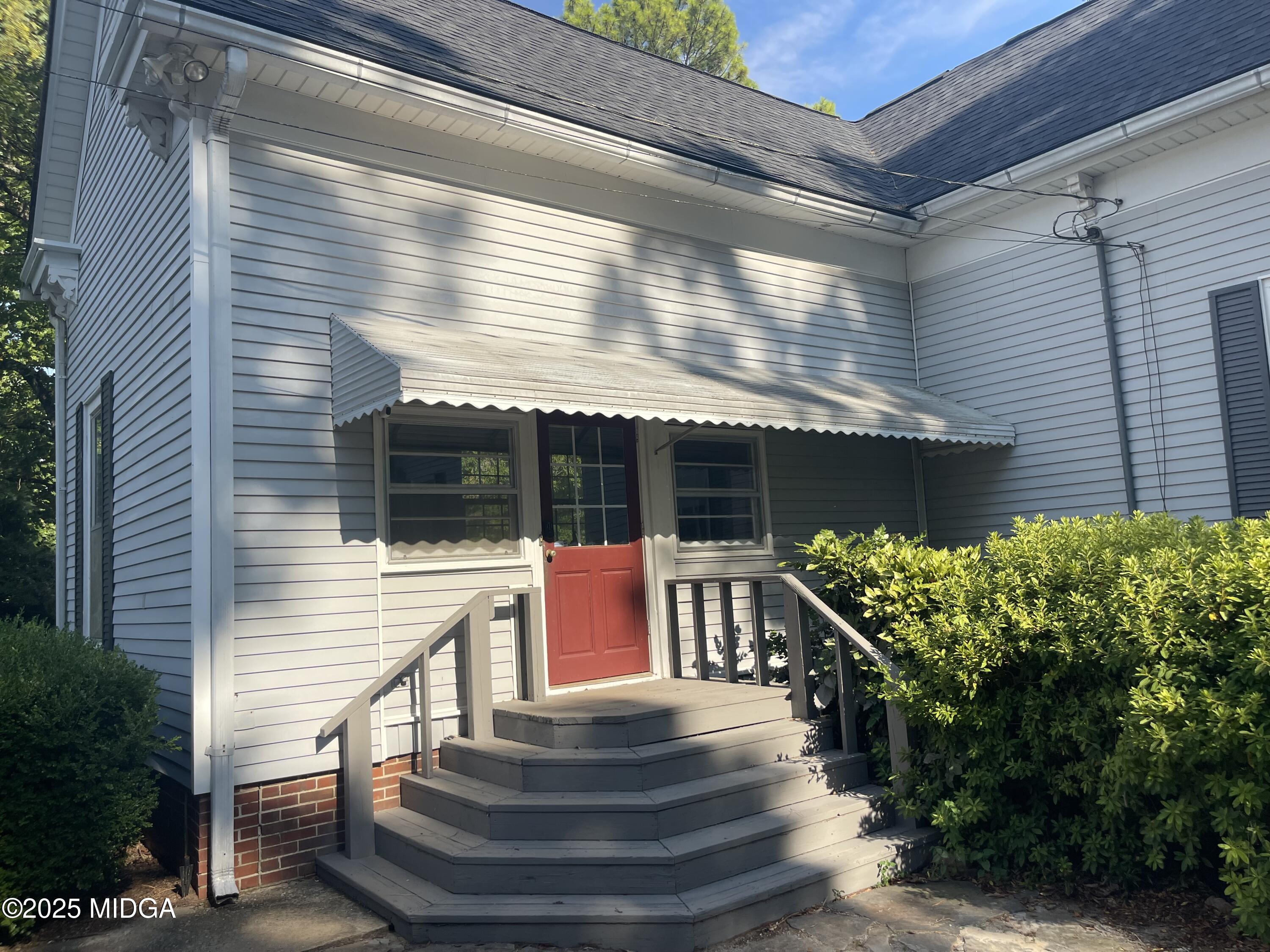 307 Woolfolk Road Fort Valley, GA 31030 - Photo 11 of 62 a front view of a house with a yard