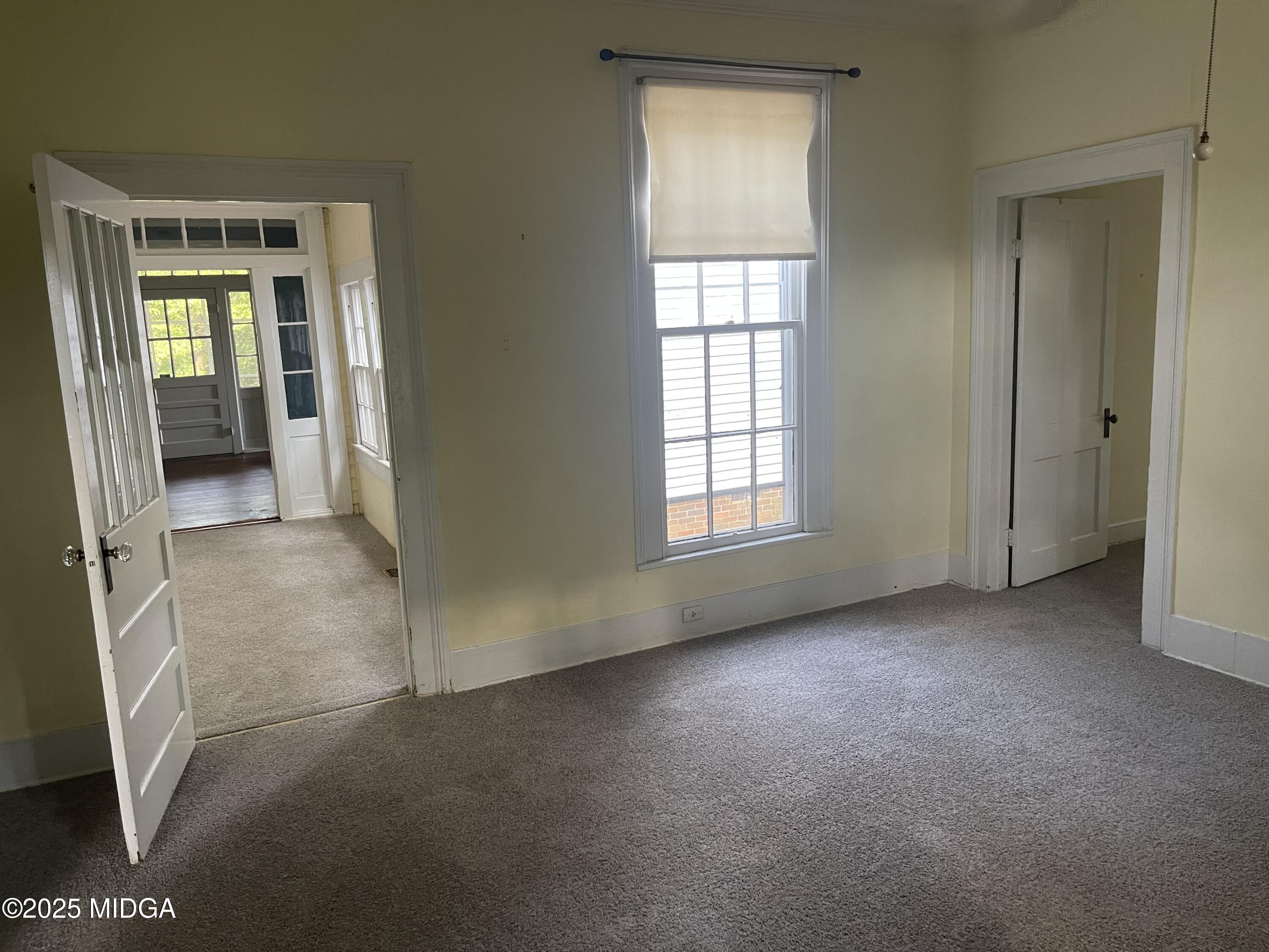 307 Woolfolk Road Fort Valley, GA 31030 - Photo 25 of 62 an empty room with windows
