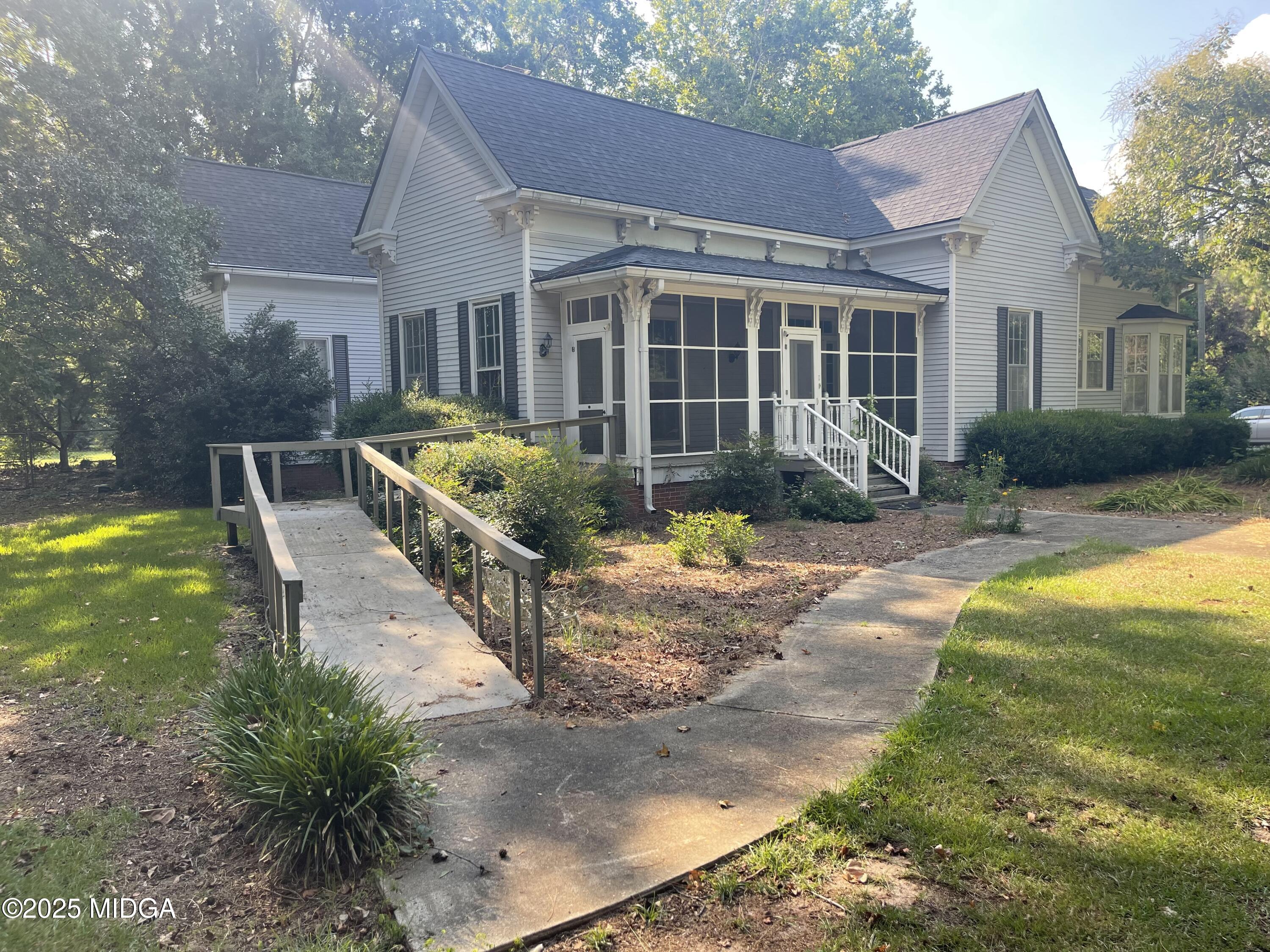307 Woolfolk Road Fort Valley, GA 31030 - Photo 3 of 62 a front view of house with yard and green space