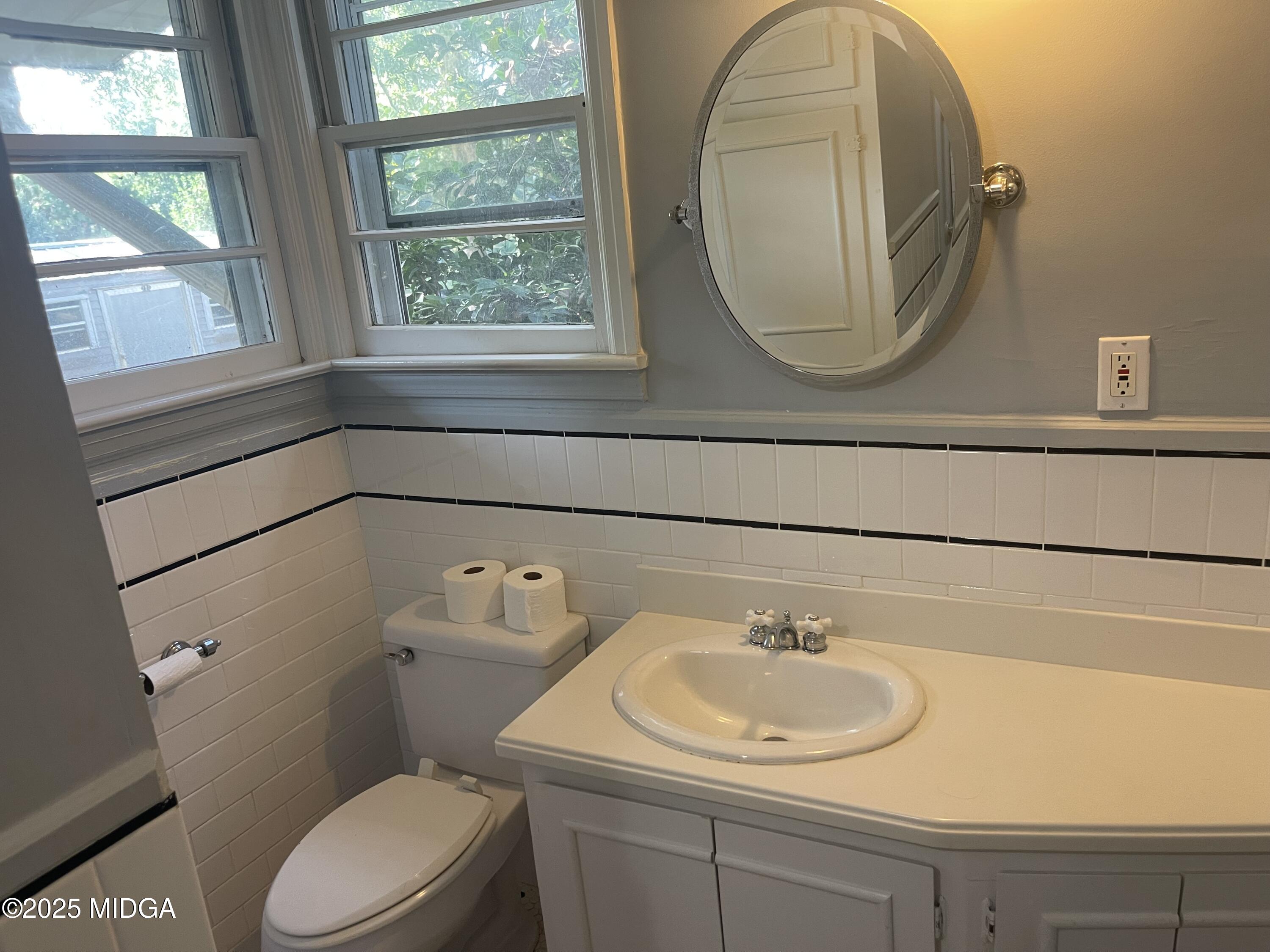 307 Woolfolk Road Fort Valley, GA 31030 - Photo 32 of 62 a bathroom with a sink and a toilet
