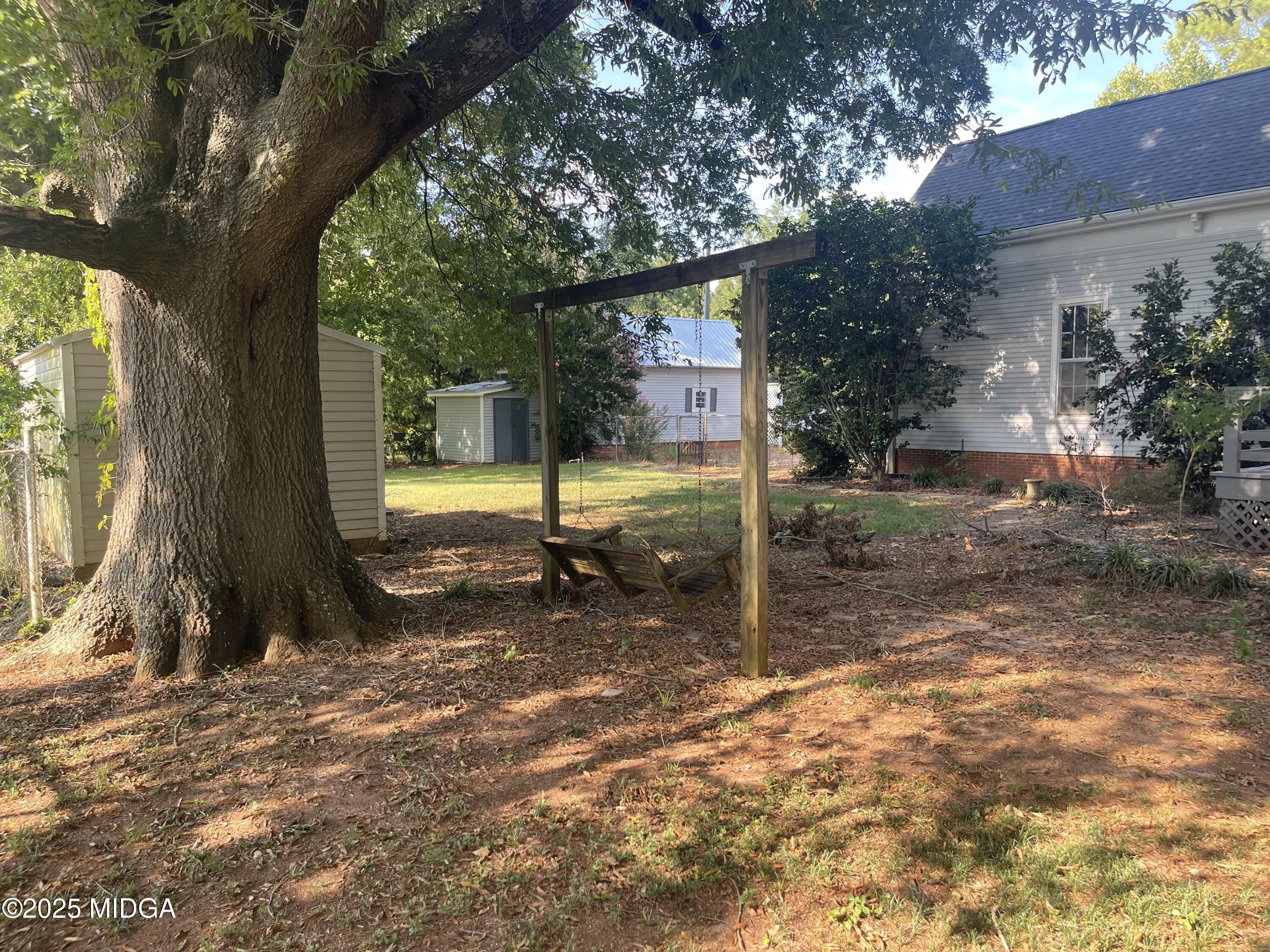 307 Woolfolk Road Fort Valley, GA 31030 - Photo 9 of 62 a view of a house with a yard