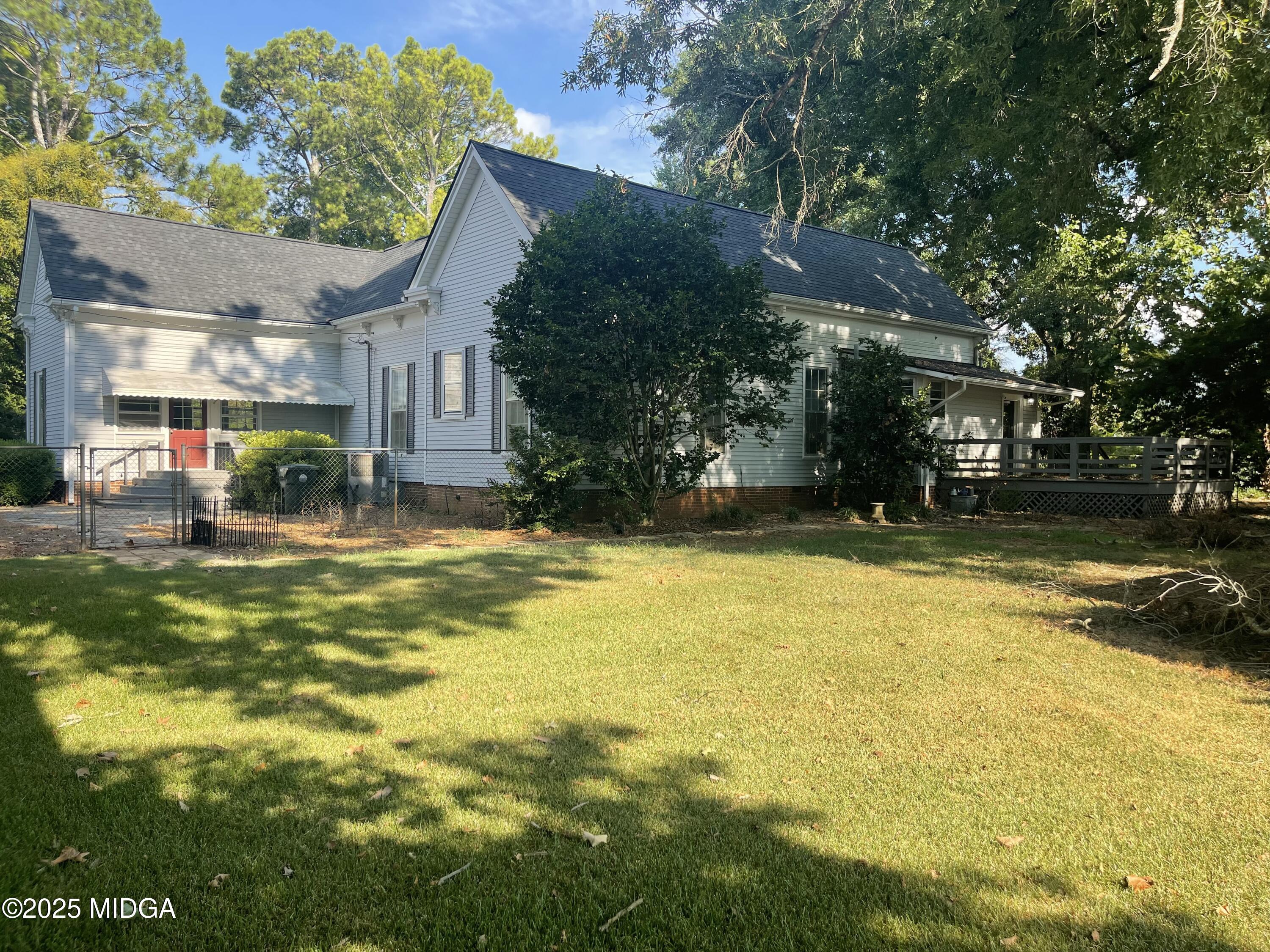 307 Woolfolk Road Fort Valley, GA 31030 - Photo 10 of 62 a house view with swimming pool in front of it