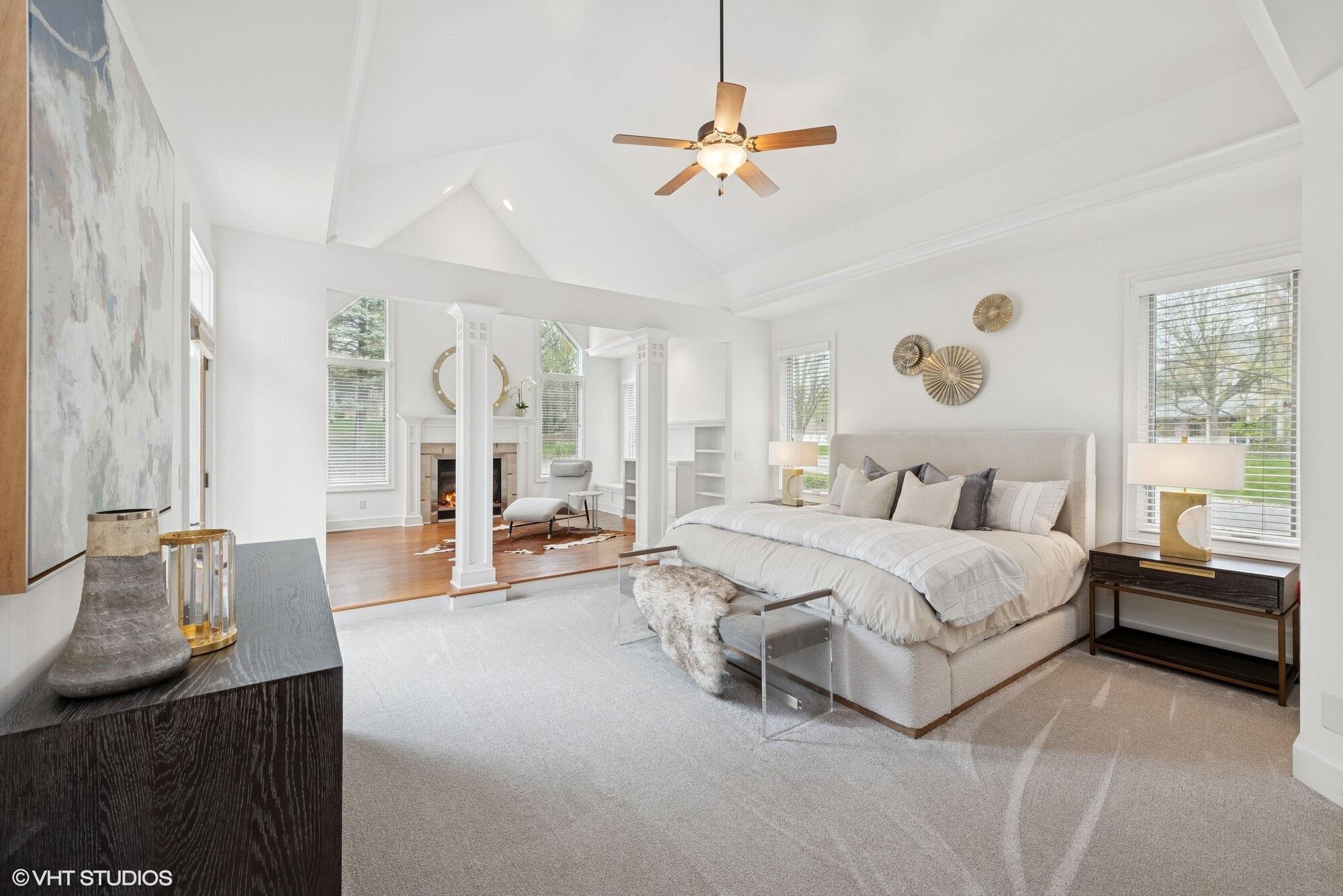 2252 Marrell Hill Road Valparaiso, IN 46385 - Photo 17 of 49 a spacious bedroom with a bed a chandelier and large window