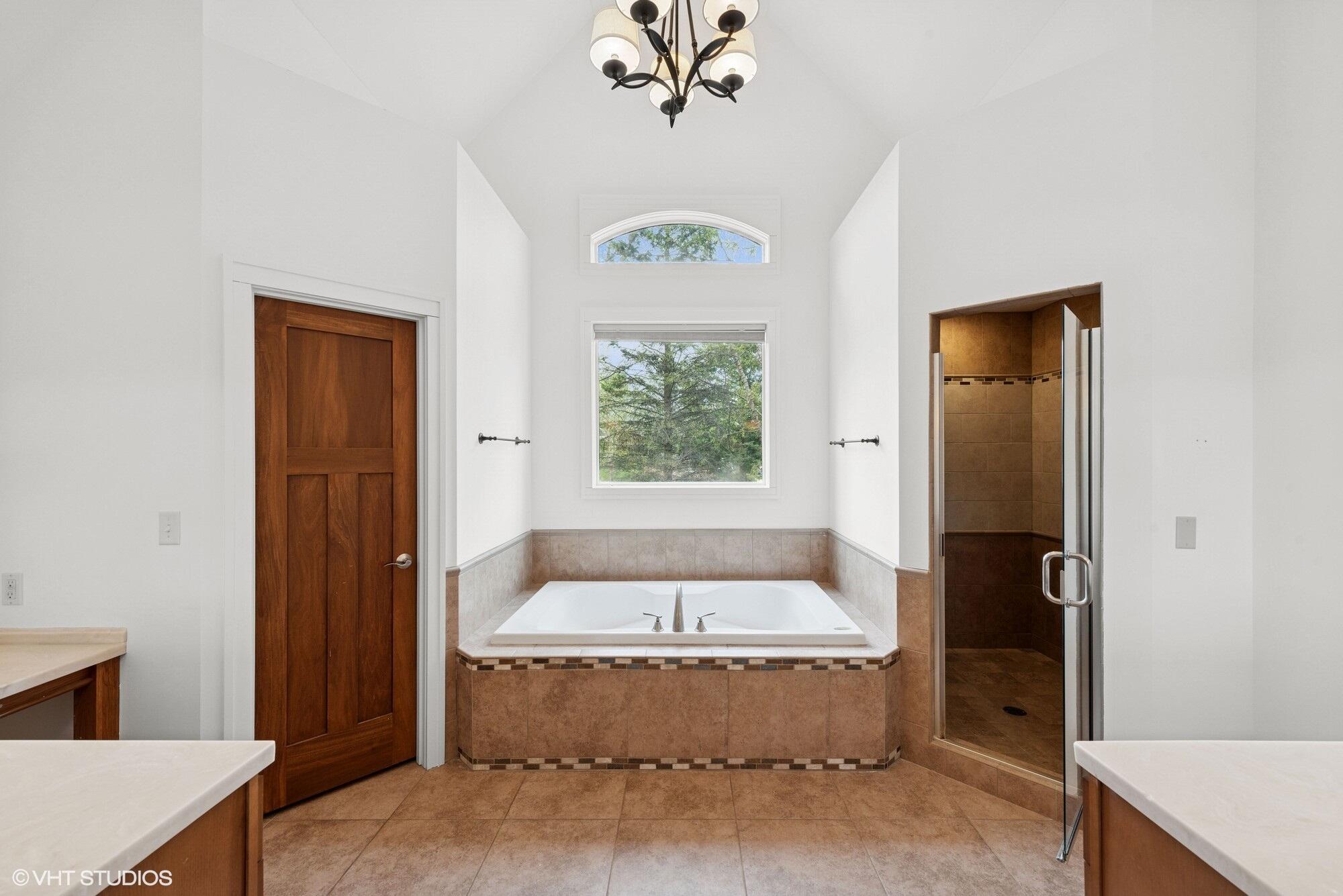2252 Marrell Hill Road Valparaiso, IN 46385 - Photo 22 of 49 a bathroom with a tub and a window