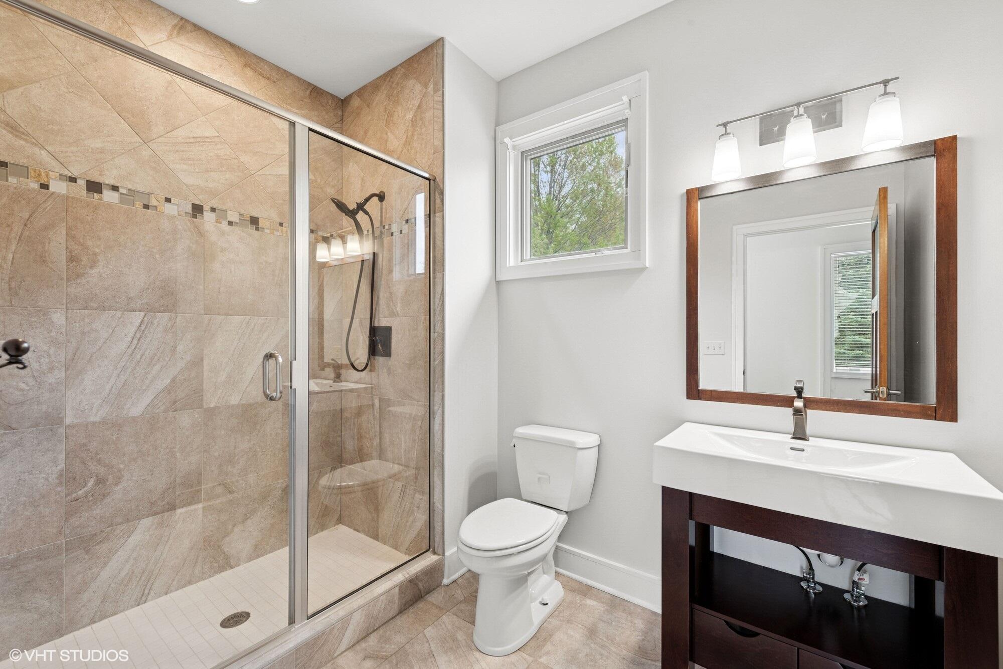2252 Marrell Hill Road Valparaiso, IN 46385 - Photo 23 of 49 a bathroom with a sink a toilet and shower