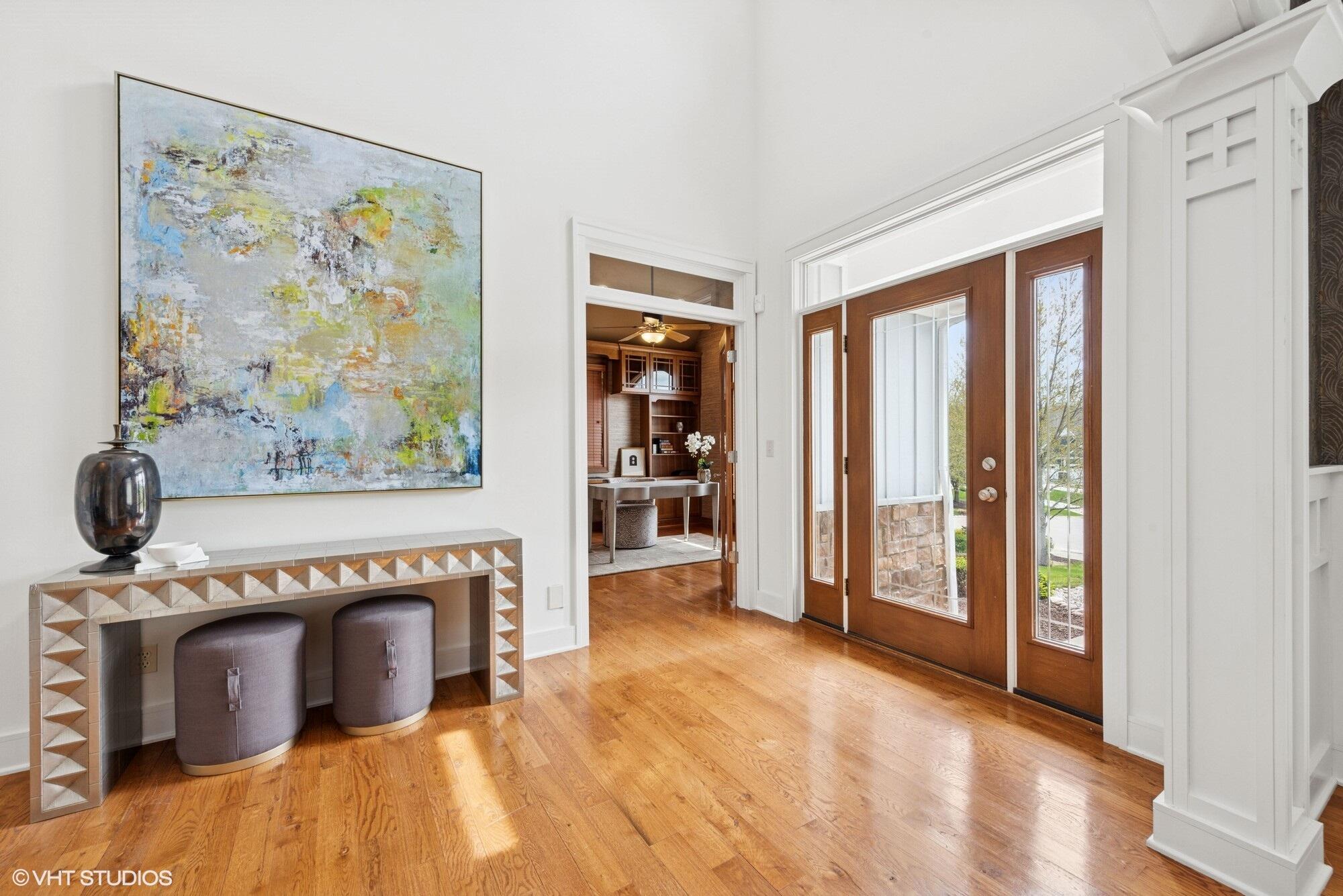 2252 Marrell Hill Road Valparaiso, IN 46385 - Photo 3 of 49 a view of a livingroom with wooden floor and a fireplace