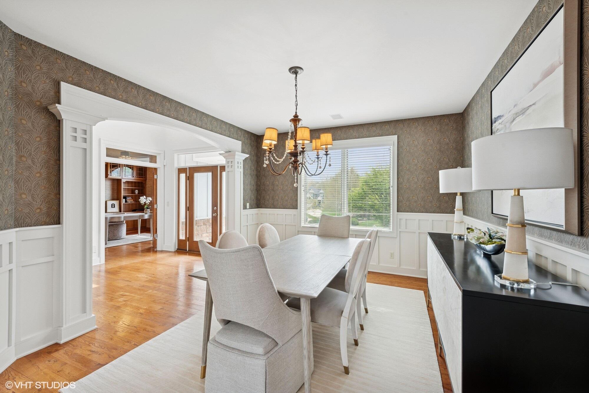 2252 Marrell Hill Road Valparaiso, IN 46385 - Photo 5 of 49 a dining room with furniture a chandelier and wooden floor