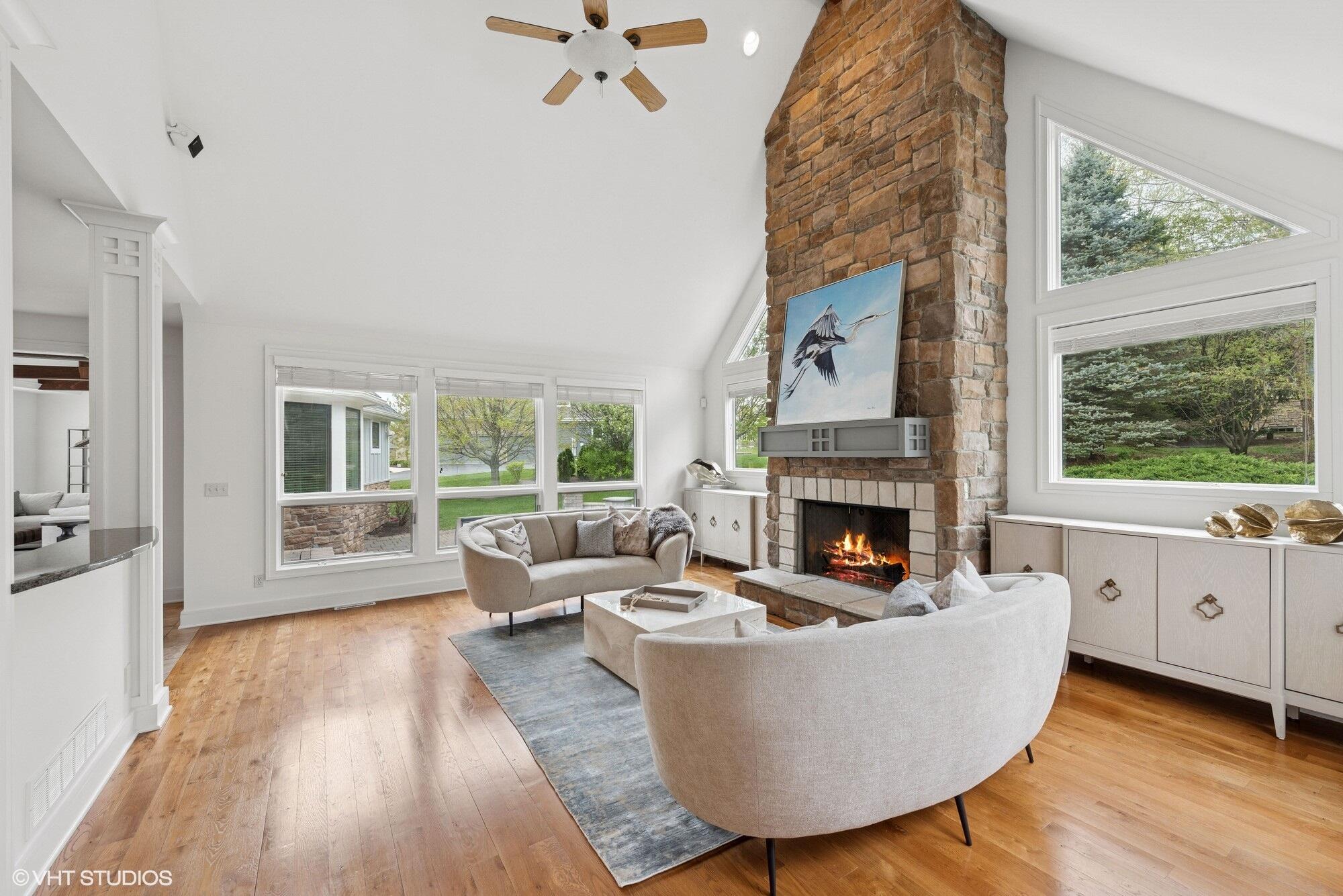 2252 Marrell Hill Road Valparaiso, IN 46385 - Photo 9 of 49 a living room with furniture a fireplace and a large window