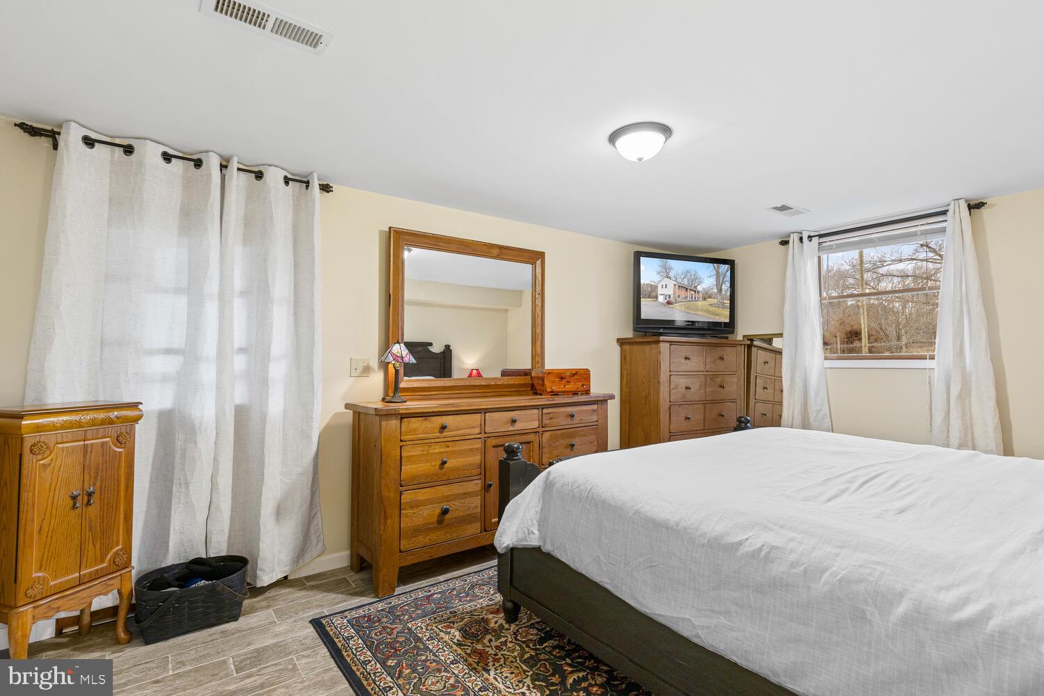 1573 Garrisonville Road Stafford, VA 22556 - Photo 22 of 63 a bedroom with a bed and a dresser