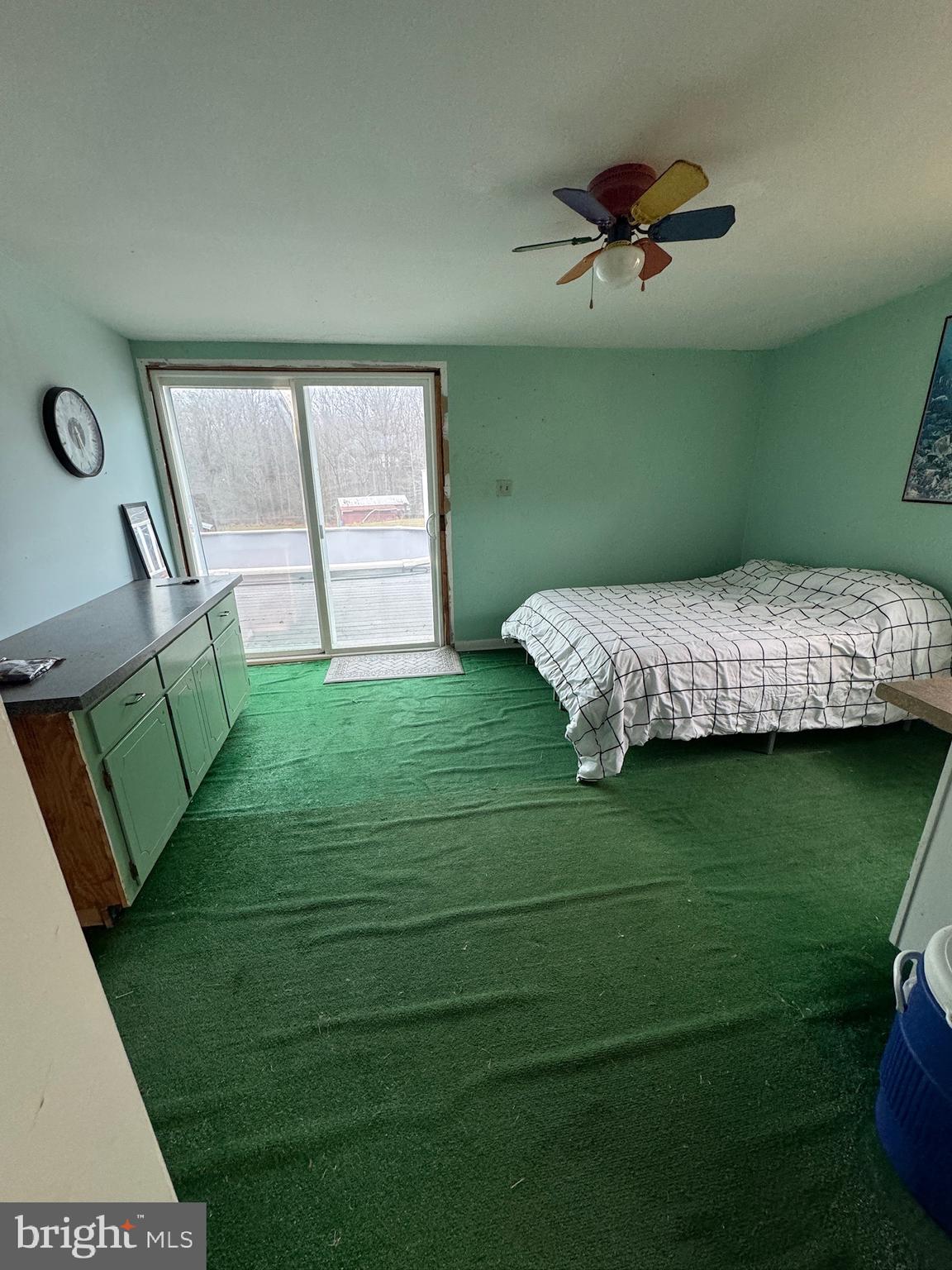 1573 Garrisonville Road Stafford, VA 22556 - Photo 61 of 63 a bed sitting in a bedroom next to a window