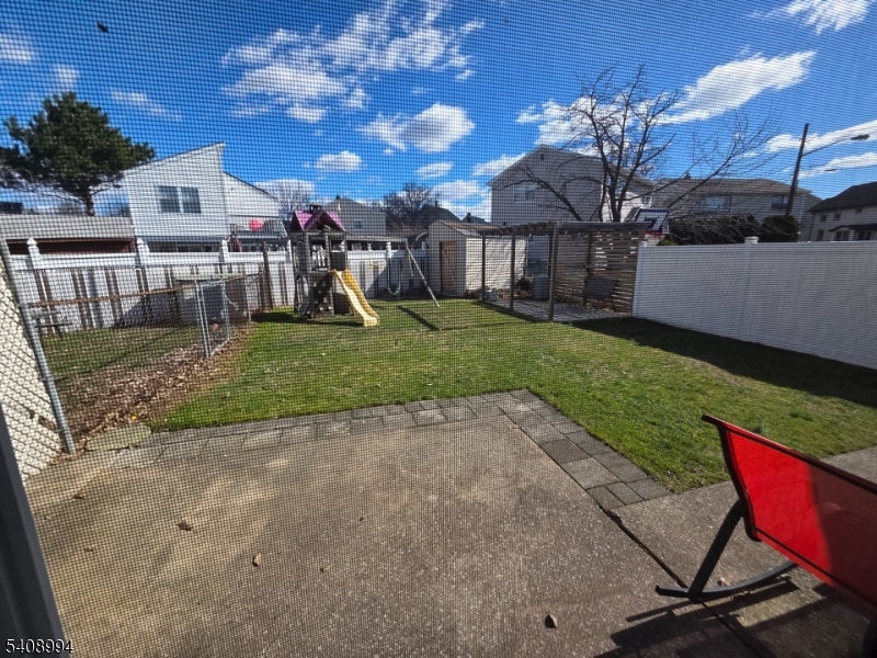 86 Bergen Turnpike, Unit A Ridgefield Park, NJ 07660 - Photo 13 of 14 a view of a house with backyard and sitting area