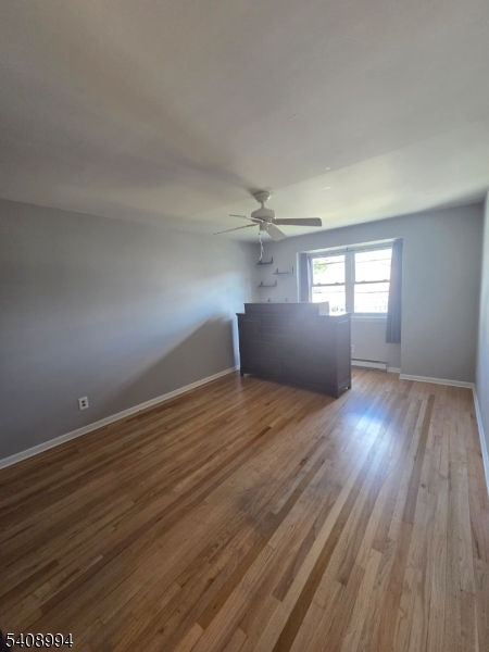 86 Bergen Turnpike, Unit A Ridgefield Park, NJ 07660 - Photo 14 of 14 an empty room with wooden floor and windows