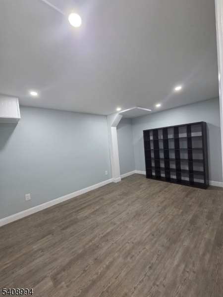 86 Bergen Turnpike, Unit A Ridgefield Park, NJ 07660 - Photo 3 of 14 a view of an empty room with a wooden floor and closet