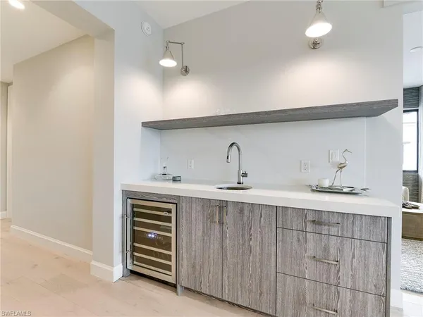a kitchen with a sink and cabinets