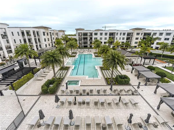 a view of house with outdoor space and swimming pool