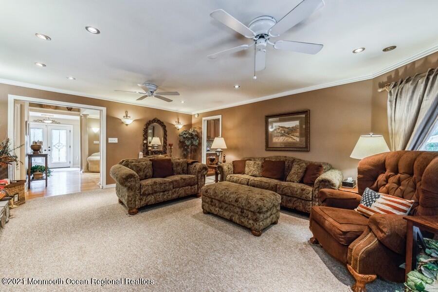 57 Millay Road Morganville, NJ 07751 - Photo 20 of 46 a living room with furniture and a large window
