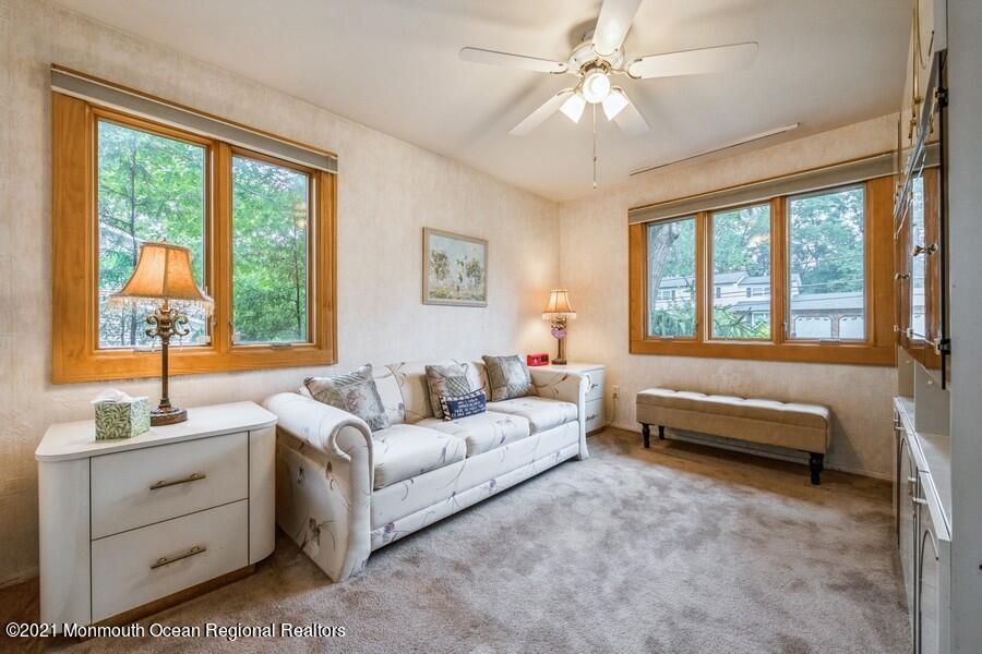 57 Millay Road Morganville, NJ 07751 - Photo 23 of 46 a spacious bedroom with a bed and a large window