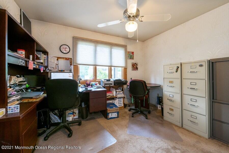 57 Millay Road Morganville, NJ 07751 - Photo 24 of 46 a view of a workspace with furniture and a window