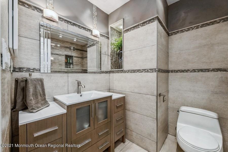 57 Millay Road Morganville, NJ 07751 - Photo 25 of 46 a bathroom with a sink toilet and shower