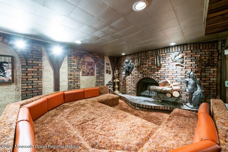 57 Millay Road Morganville, NJ 07751 - Photo 29 of 46 a bed room with a bed and a fireplace