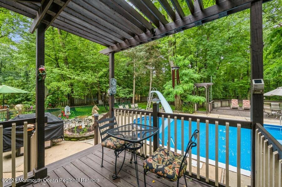 57 Millay Road Morganville, NJ 07751 - Photo 31 of 46 a view of a chair and table in the balcony
