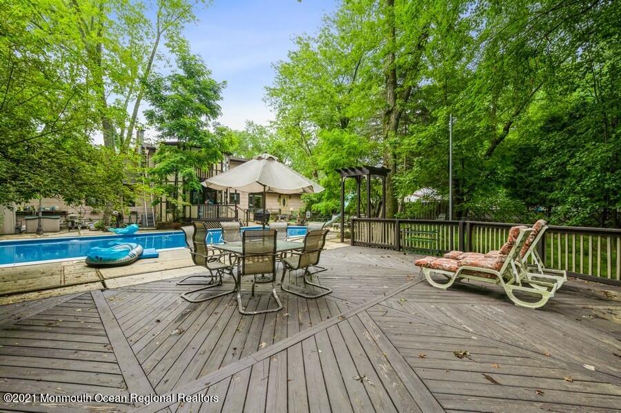 57 Millay Road Morganville, NJ 07751 - Photo 35 of 46 a patio with wooden floor and outdoor seating