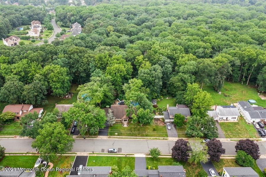 57 Millay Road Morganville, NJ 07751 - Photo 36 of 46 an aerial view of a house with a yard basket ball court and outdoor seating
