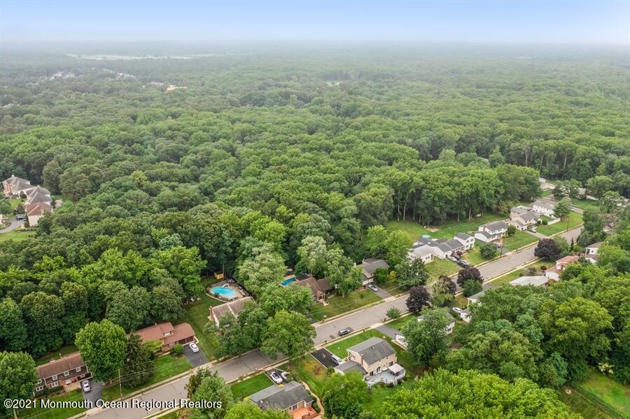 57 Millay Road Morganville, NJ 07751 - Photo 38 of 46 an aerial view of residential houses with outdoor space and trees