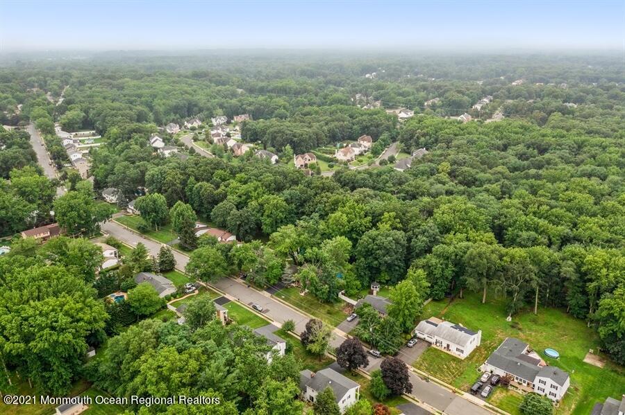 57 Millay Road Morganville, NJ 07751 - Photo 39 of 46 an aerial view of residential houses with outdoor space and trees