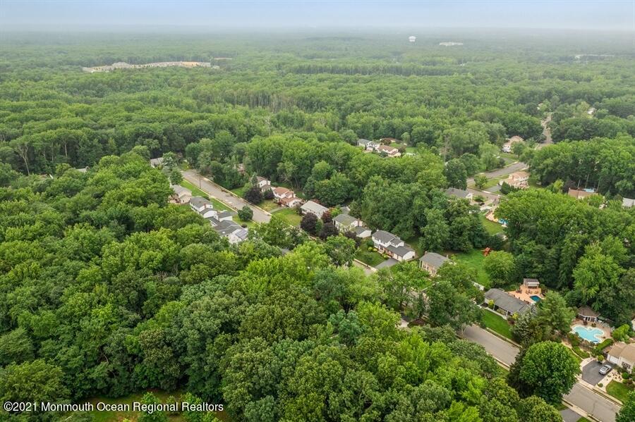 57 Millay Road Morganville, NJ 07751 - Photo 41 of 46 an aerial view of residential houses with outdoor space and trees