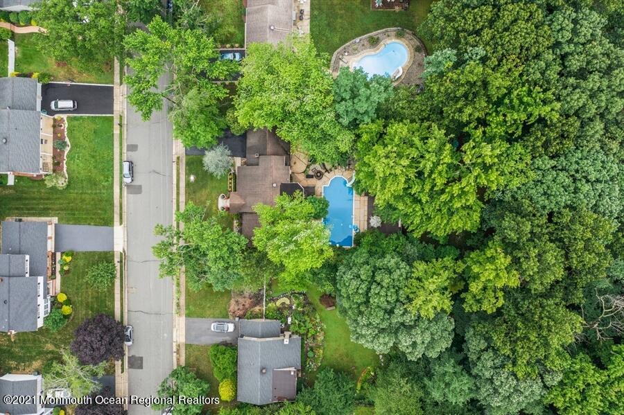 57 Millay Road Morganville, NJ 07751 - Photo 42 of 46 an aerial view of a house with a yard and garden