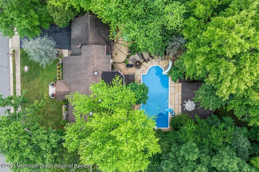 57 Millay Road Morganville, NJ 07751 - Photo 43 of 46 an aerial view of a house with a yard and a large tree