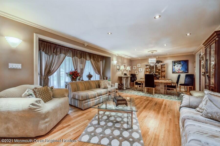 57 Millay Road Morganville, NJ 07751 - Photo 8 of 46 a living room with furniture and a large window