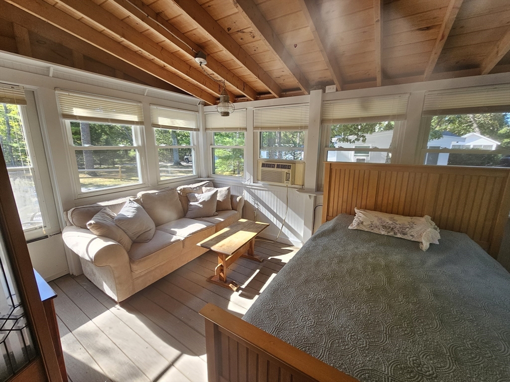 1937 State Hwy Route, Unit 8 Wellfleet, MA 02667 - Photo 11 of 17 a living room with furniture and a large window