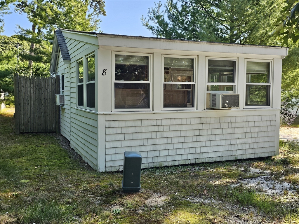 1937 State Hwy Route, Unit 8 Wellfleet, MA 02667 - Photo 2 of 17 a view of a house with a yard