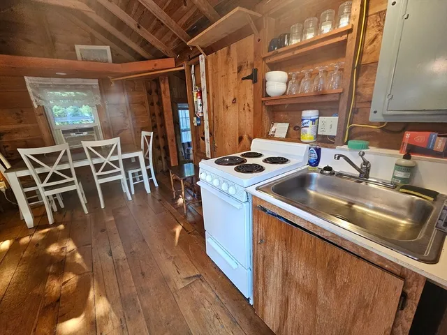 a utility room with lots of appliances and cabinets